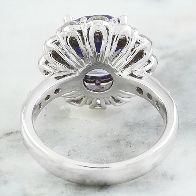 Os joalheiro batem 1/4 de quilate T.G.W. Tanzanite And White Diamond Accent Sterling Silver Ring
