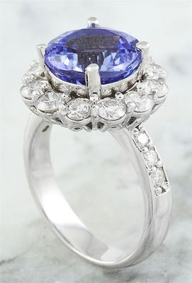 Os joalheiro batem 1/4 de quilate T.G.W. Tanzanite And White Diamond Accent Sterling Silver Ring